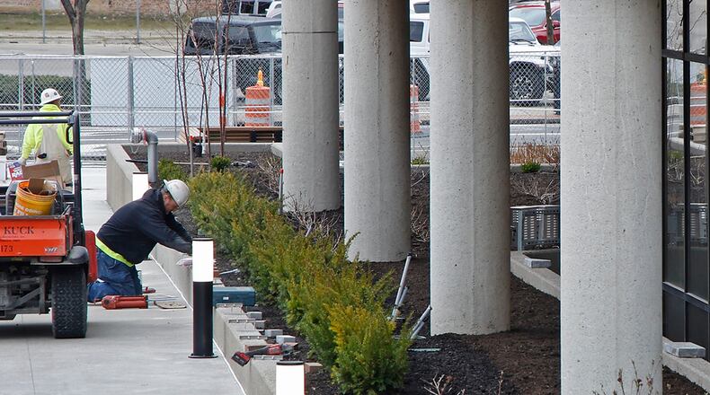Work continues outside the Springfield City Hall on the plaza renovations Tuesday, March 26, 2024. BILL LACKEY/STAFF