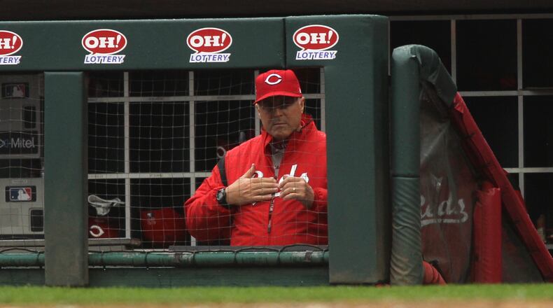 Reds manager Bryan Price calls a play during a game against the Cardinals on Sunday, April 15, 2018, at Great American Ball Park in Cincinnati. David Jablonski/Staff