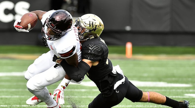 WINSTON SALEM, NC - OCTOBER 28: Defensive back Jessie Bates III #3 of the Wake Forest Demon Deacons tackles wide receiver Dez Fitzpatrick #87 of the Louisville Cardinals during the football game at BB&T Field on October 28, 2017 in Winston Salem, North Carolina. (Photo by Mike Comer/Getty Images)