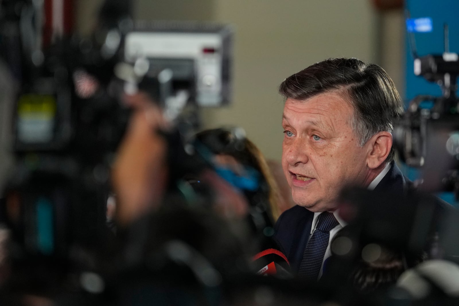 Presidential candidate Crin Antonescu speaks to media during a meeting with supporters after polls closed for the first round of the country's presidential election redo in Bucharest, Romania, Sunday, May 4, 2025. (AP Photo/Vadim Ghirda)