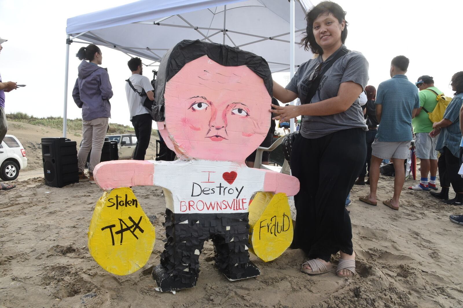 Natalia Salinas holds a piñata of Elon Musk during a protest at Boca Chica beach, Texas, on Saturday afternoon, May 3, 2025, hours before polls closed for the incorporation election that would turn Starbase into an official Texas city. (AP Photo/Valerie Gonzalez)