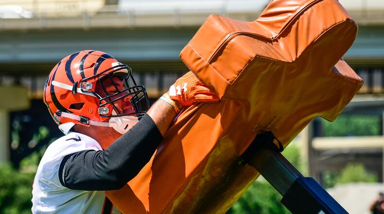 Cincinnati Bengals tight end C.J. Uzomah hits the sled during practice Tuesday, June 6, 2017, on their practice fields next to Paul Brown Stadium in Cincinnati. NICK GRAHAM/STAFF