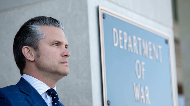 Defense Secretary Pete Hegseth stands outside the Pentagon during a welcome ceremony for Japanese Defense Minister Shinjirō Koizumi at the Pentagon, Thursday, Jan. 15, 2026 in Washington. (AP Photo/Kevin Wolf/)