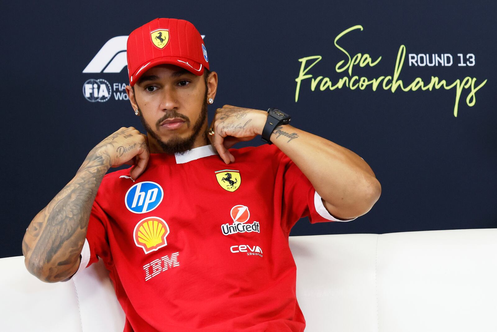 Ferrari driver Lewis Hamilton of Britain attends a media conference ahead of the Formula One Grand Prix at the Spa-Francorchamps racetrack in Spa, Belgium, Thursday, July 24, 2025. (AP Photo/Geert Vanden Wijngaert)