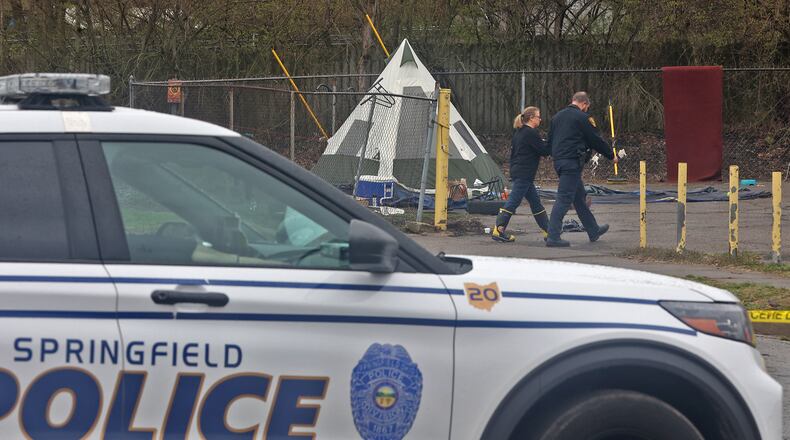 Springfield police investigate a homicide at a homeless encampment at 901 West Main Street Wednesday, April 6, 2022. BILL LACKEY/STAFF