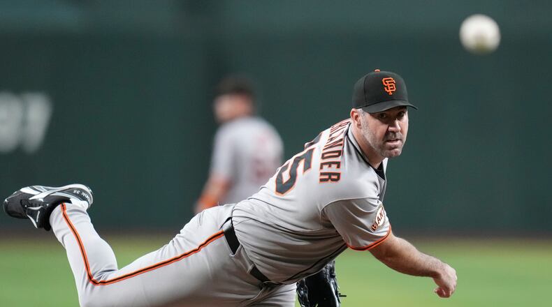 FILE - San Francisco Giants starting pitcher Justin Verlander warms up during the first inning of a baseball game against the Arizona Diamondbacks Wednesday, Sept. 17, 2025, in Phoenix. (AP Photo/Ross D. Franklin, File)