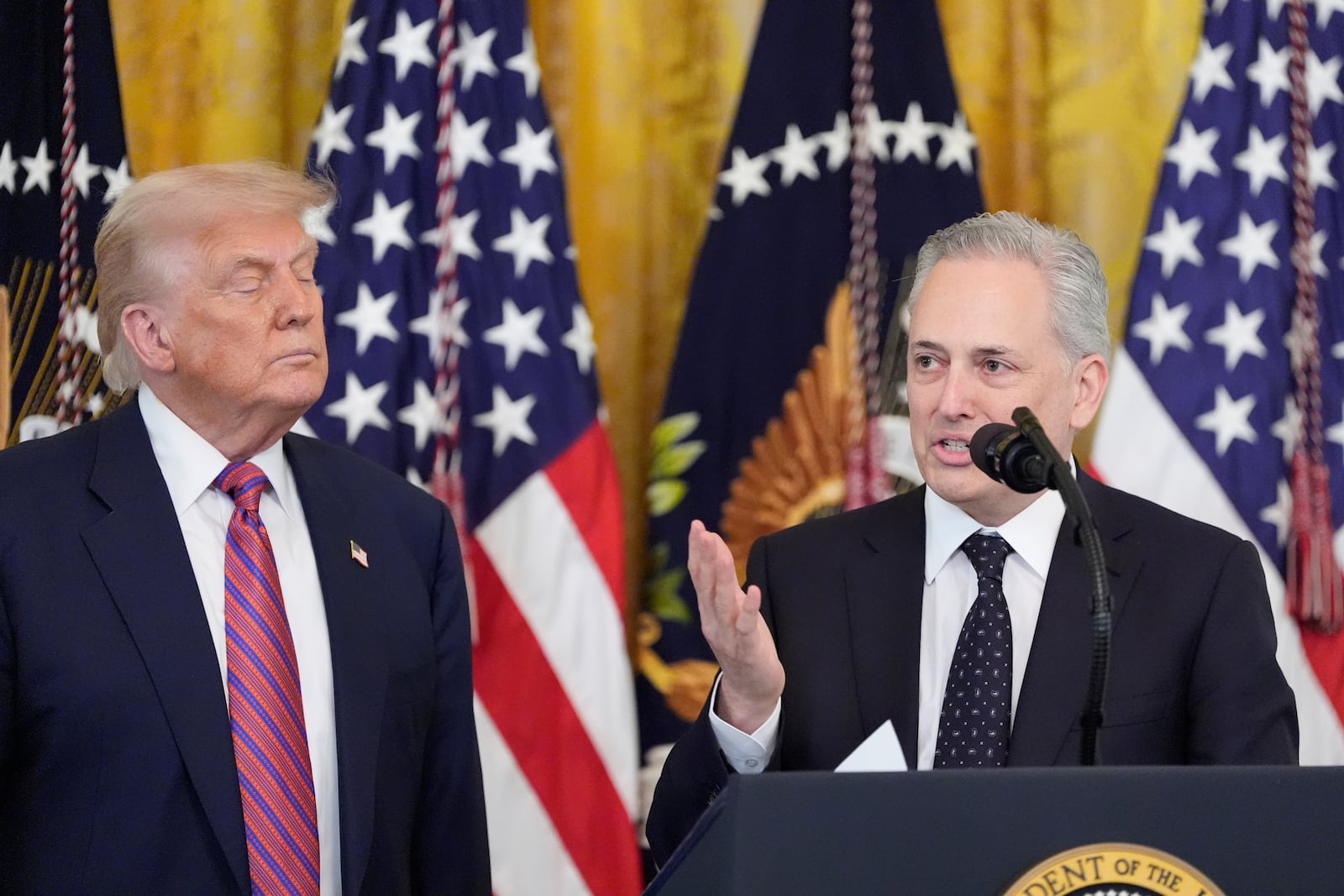 White House AI and crypto czar David Sacks speaks as President Donald Trump listens at an event for the signing of the GENIUS Act, a bill that regulates stablecoins, a type of cryptocurrency, in the East Room of the White House, Friday, July 18, 2025, in Washington. (AP Photo/Alex Brandon)