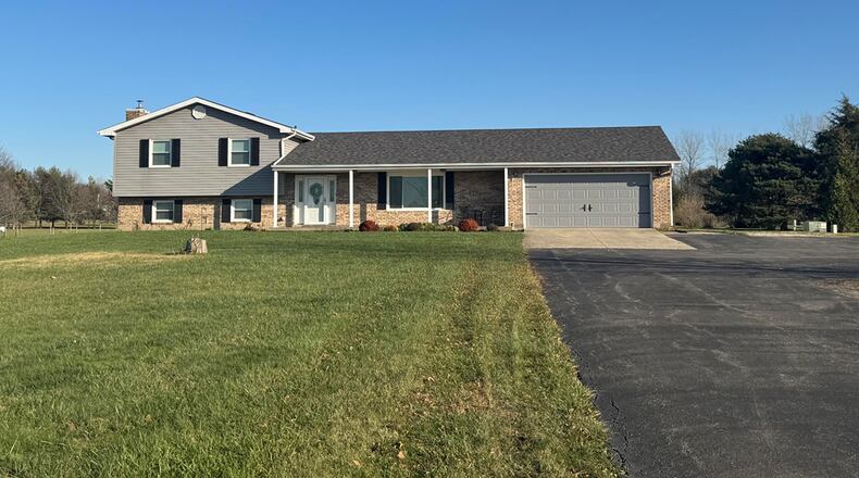 This 2,103 square foot tri level sits on five plus acres in New Carlisle