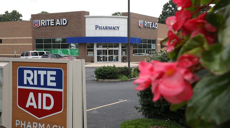 Rite Aid is cutting 400 full-time jobs and three its top leaders are leaving the company. BILL LACKEY/STAFF