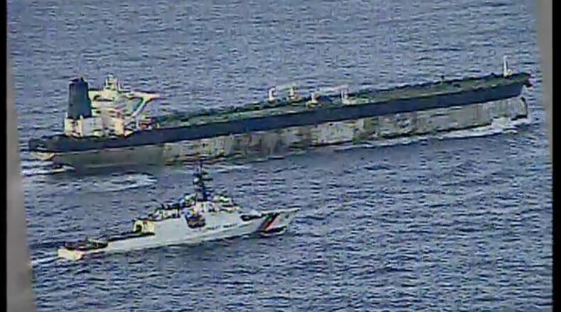 This image from video provided by the U.S. Department of Defense, shows the U.S. Coast Guard cutter Munro shadowing the MV Bella 1 in the North Atlantic Ocean during the maritime interdiction operation Wednesday, Jan. 7, 2026. (Department of Defense via AP)