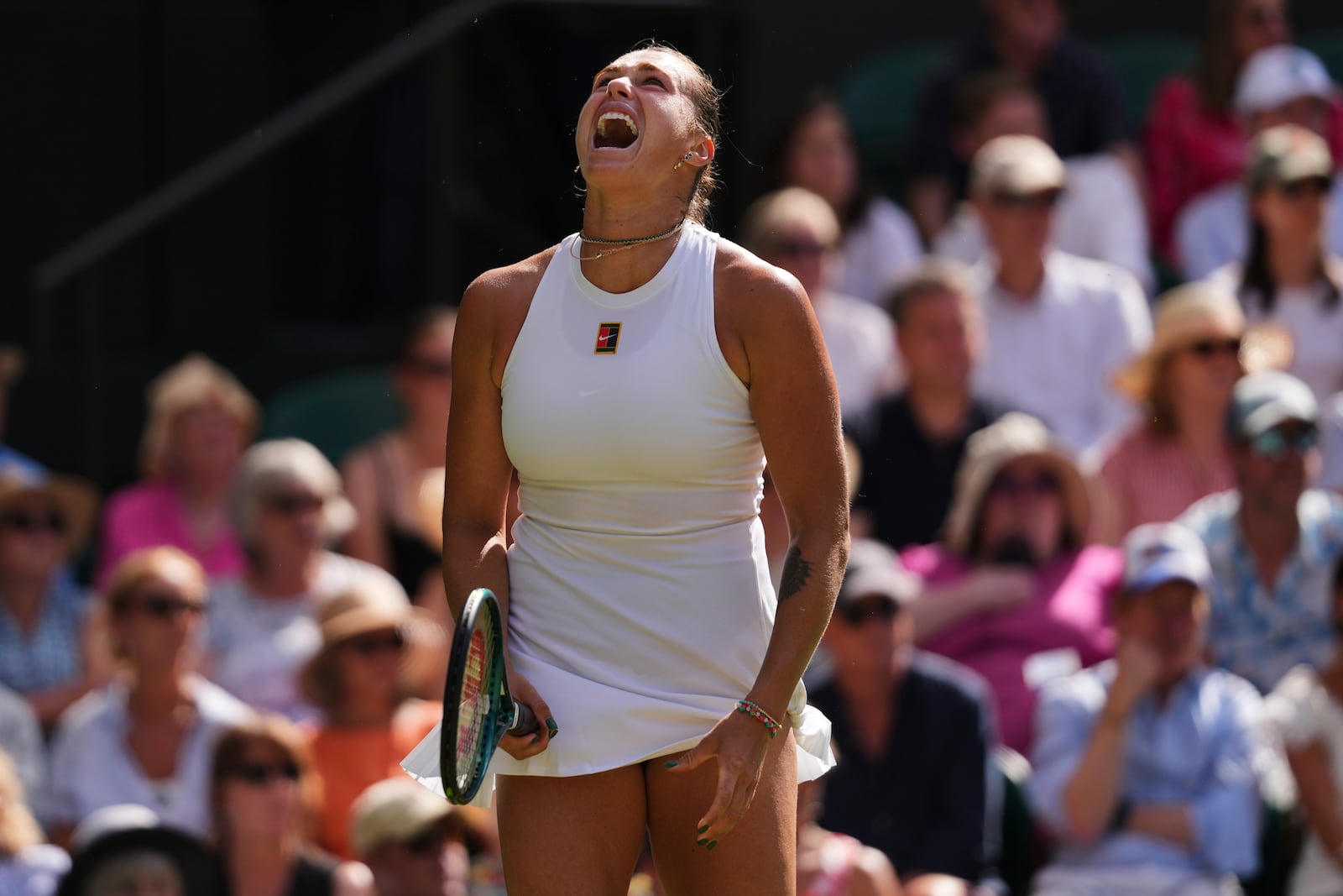 Aryna Sabalenka of Belarus shouts during the women's singles semifinal match against Amanda Anisimova of the U.S. at the Wimbledon Tennis Championships in London, Thursday, July 10, 2025.(AP Photo/Kirsty Wigglesworth)