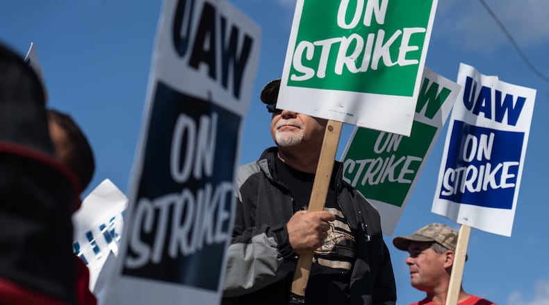 UAW members stand on the picket line outside the General Motors Flint Assembly plant earlier this month as they remain on strike from General Motors. (Ryan Garza/Detroit Free Press/TNS)