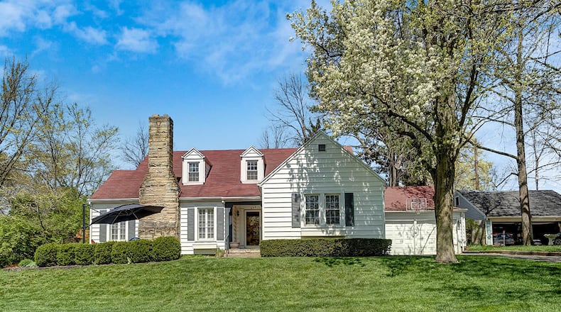 The 4-bedroom home offers about 2,620 sq. ft. of living space and features a stone patio in front that leads to a covered front porch. The home includes a finished lower level with family and recreation rooms. CONTRIBUTED PHOTO