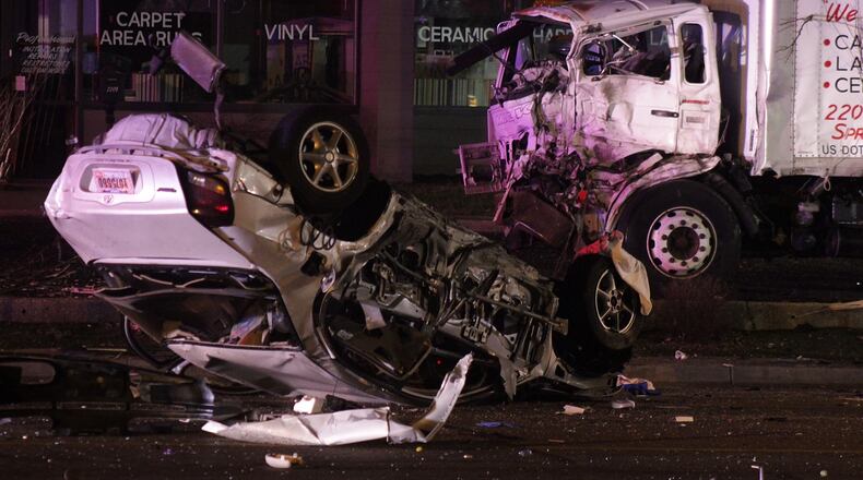 The car lies overturned after it crashed during a Springfield police pursuit.