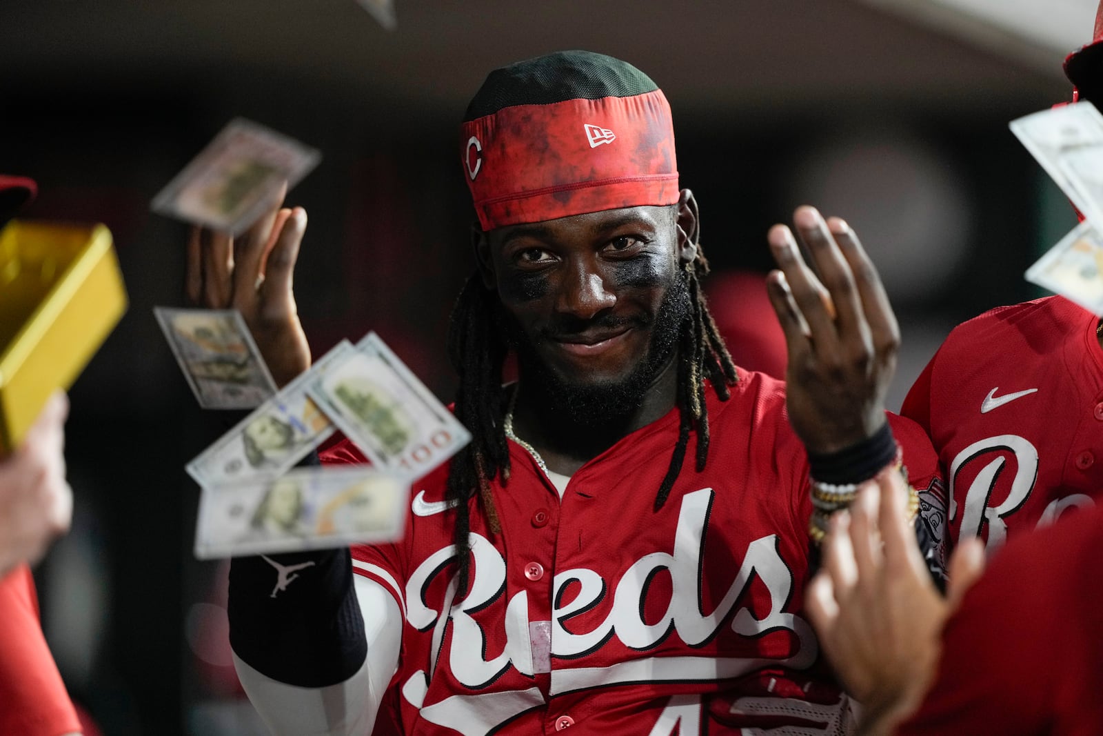 Cincinnati Reds' Elly De La Cruz celebrated in the dugout after Will Benson hit a solo home run during the eighth inning of a baseball game against the Miami Marlins in Cincinnati, Wednesday, July 9, 2025. (AP Photo/Carolyn Kaster)