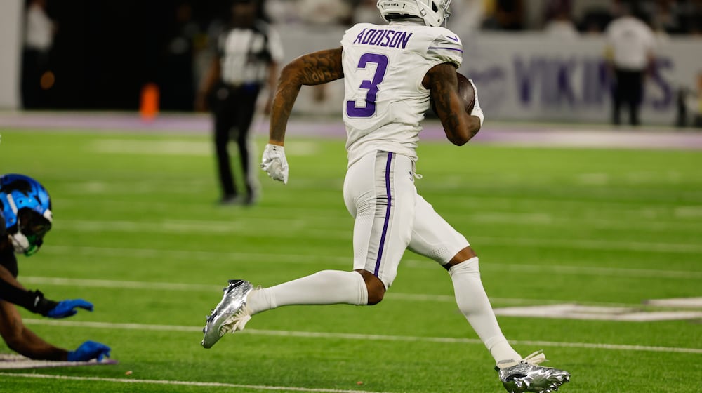 Minnesota Vikings wide receiver Jordan Addison runs to score a touchdown during the second half of an NFL football game against the Detroit Lions, Thursday, Dec. 25, 2025, in Minneapolis. (AP Photo/Bruce Kluckhohn)