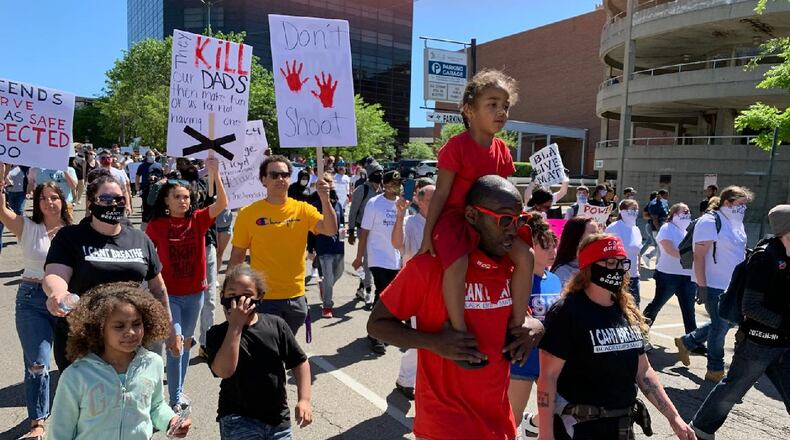 Hundreds gathered in downtown Springfield on Sunday, May 31, 2020 to protest racial injustices in the country following the death of an unarmed black man in Minneapolis Police custody. BILL LACKEY / STAFF