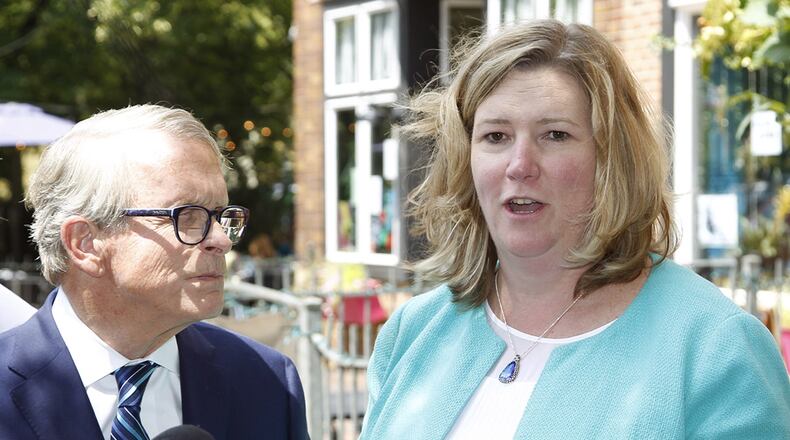 Ohio Governor Mike DeWine is shown in a joint press conference with Dayton Mayor Nan Whaley on Aug. 8 in the Oregon District to talk about mental health initiatives in the wake of the mass shooting that took place on Aug. 4, 2019. DeWine signed a bill that no longer requires Ohioans to first consider retreating in public spaces before using deadly force in self defense. Whaley has criticized the bill and said DeWine has failed to advance reforms he proposed after Dayton's mass shooting. TY GREENLEES / STAFF