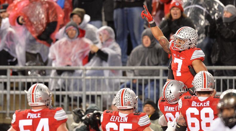 COLUMBUS, OH - NOVEMBER 21: Jalin Marshall #7 of the Ohio State Buckeyes celebrates after catching a six-yard touchdown pass in the third quarter against the Michigan State Spartans at Ohio Stadium on November 21, 2015 in Columbus, Ohio. Michigan State defeated Ohio State 17-14. (Photo by Jamie Sabau/Getty Images)