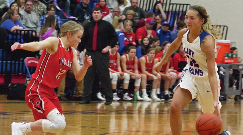 Greeneview senior Frankie Fife dribbles up court against Cedarville’s Sami Buettell. Fife scored 17 points and surpassed 1,000 career points in the Rams’ OHC-clinching 65-36 victory. Jeff Gilbert/CONTRIBUTED