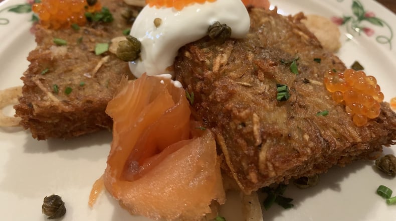 Ambrose and Eve loaded hash brown ($13) dressed up with smoked salmon, fried pickled onion, capers, creme fraiche and caviar. CONTRIBUTED PHOTO BY ALEXIS LARSEN