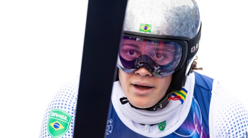 Brazil's Lucas Pinheiro Braathen checks his time at the finish area after the first run of an alpine ski, men's giant slalom race, at the 2026 Winter Olympics, in Bormio, Italy, Saturday, Feb. 14, 2026. (Michael Buholzer/Keystone via AP)