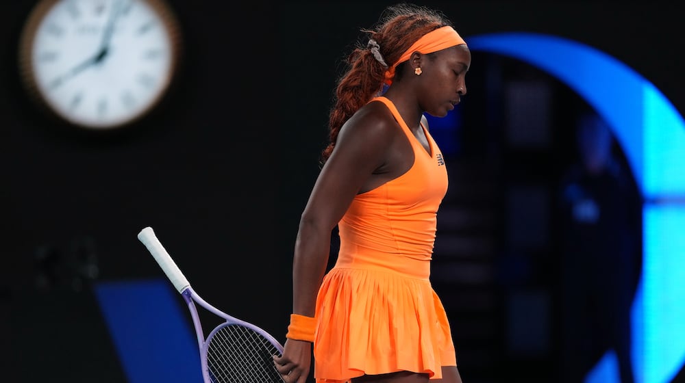 Coco Gauff of the U.S. reacts during her quarterfinal match against Elina Svitolina of Ukraine during their quarterfinal match at the Australian Open tennis championship in Melbourne, Australia, Tuesday, Jan. 27, 2026. (AP Photo/Dita Alangkara)