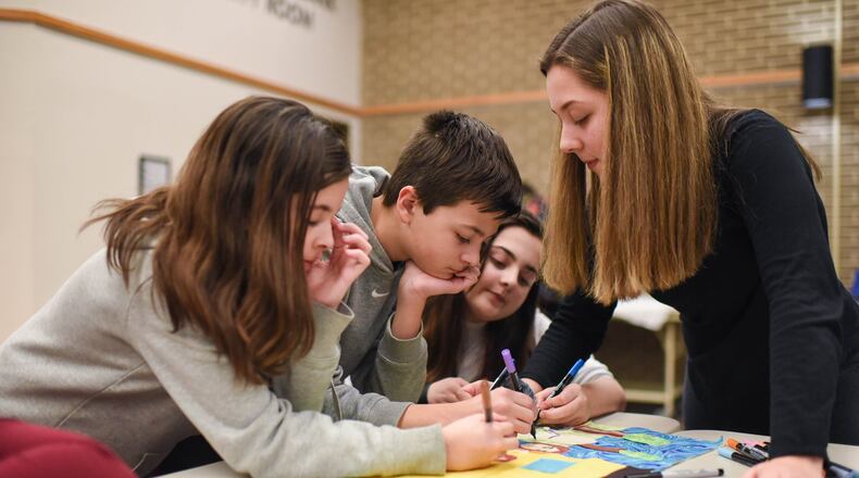 Local artists helped families create individual and collaborative art at Project Jericho s annual Winter Family Arts Camp. Photo by Lauren Houser