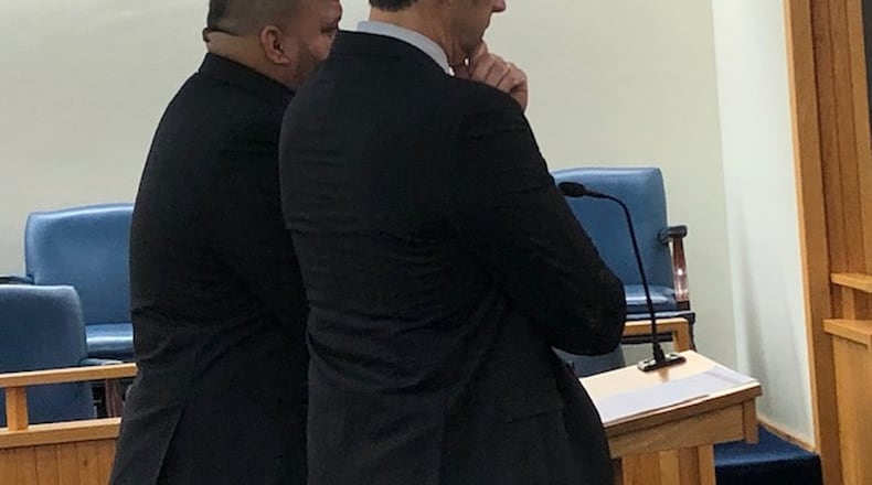 Springfield officer Joseph Robinson is on administrative leave after being charged with an OVI following a traffic stop last week. Here, Robinson (left) with his attorney Paul Kavanaugh (right) when he was charged with an OVI in 2019. STAFF