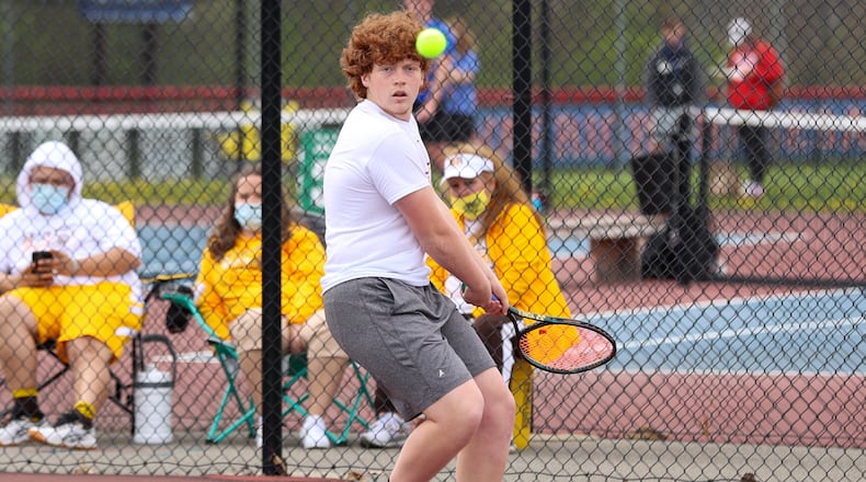 Kenton Ridge High School senior Kellen Kronour moves to hit the ball during the first singles championship match on Saturday morning at Northwestern High School. Michael Cooper/CONTRIBUTED