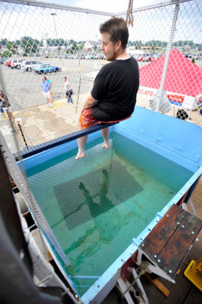 Sun columnist Andy McGinn sits in a dunking tank for charity