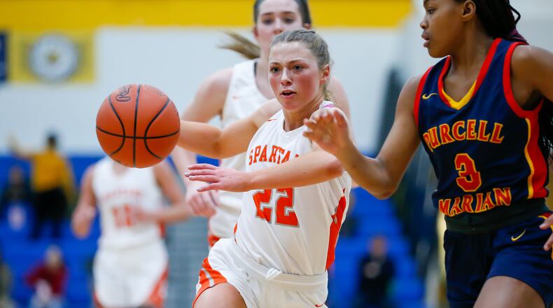 Waynesville High School senior Isabella Cassoni drives past Purcell Marian’s Ky'Aira Miller during their Division III regional semifinal game on Wednesday night in Springfield. CONTRIBUTED PHOTO BY MICHAEL COOPER