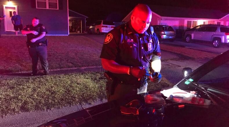 Clark County Sheriff Deputies are shown investigating a scene of a stabbing Wednesday night. (Jim Noelker/Staff)