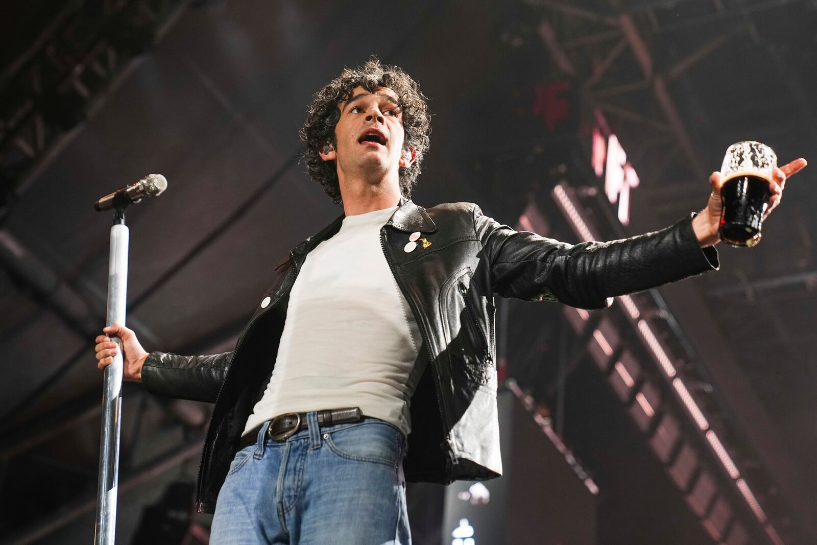 Matty Healy of The 1975 performs during the Glastonbury Festival in Worthy Farm, Somerset, England, Friday, June 27, 2025. (Scott A Garfitt/Invision/AP)