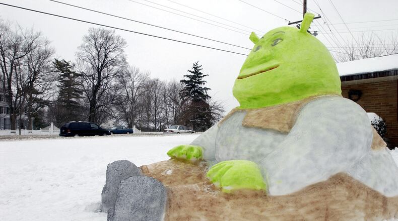 Motorists along Central Avenue in Springboro were greeted by a snow sculpture of the cartoon character Shrek on Tuesday Feb. 18, 2003. FILE PHOTO