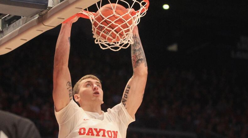 Dayton’s Chase Johnson dunks against Houston Baptist on Tuesday, Dec. 3, 2019, at UD Arena. David Jablonski/Staff
