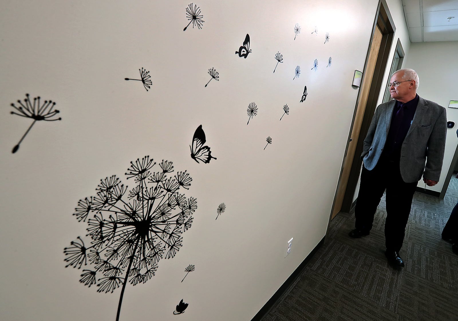 Don Warner, from Oesterlen Services for Youth, tours the new Substance Use Disorder treatment area at the Rocking Horse Center Wednesday during an open house. BILL LACKEY/STAFF
