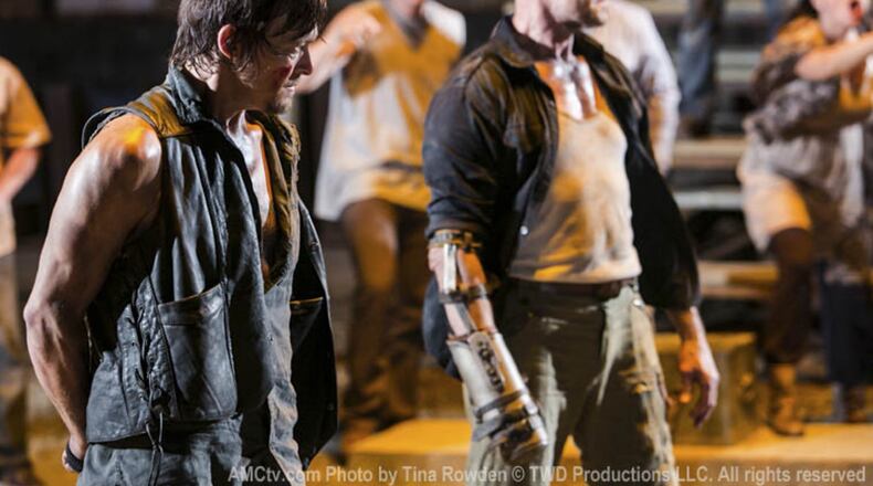 Michael Rooker as Merle (right), making resourceful use of his missing hand in “The Walking Dead.” AMC PHOTO