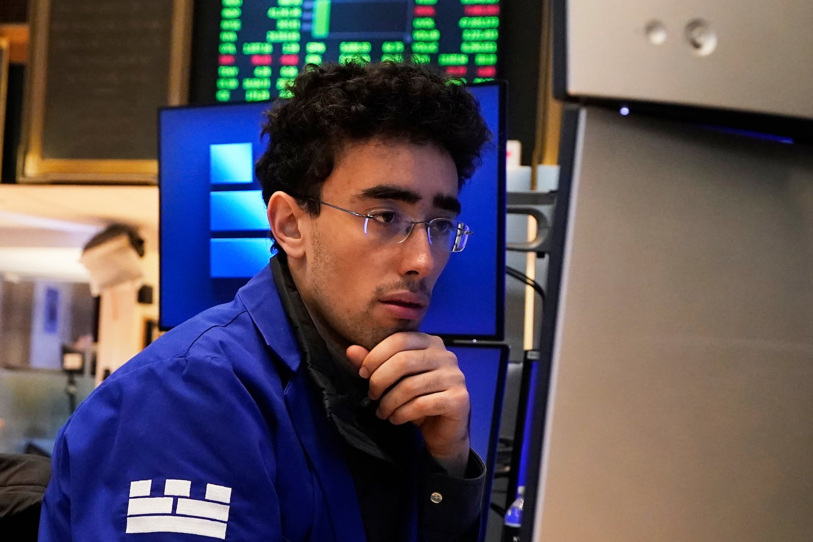 Specialist Alex Weitzman works at his post on the floor of the New York Stock Exchange, Friday, May 2, 2025. (AP Photo/Richard Drew)