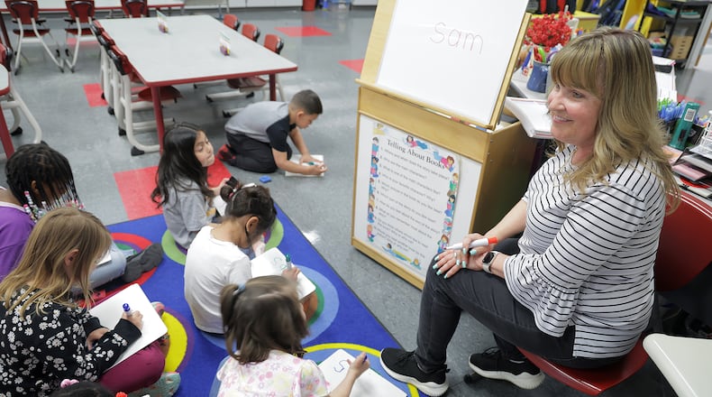 Linda Orwick, a kindergarten teacher at Kenwood Elementary, works on spelling with her class Friday, March 21, 2025. BILL LACKEY/STAFF