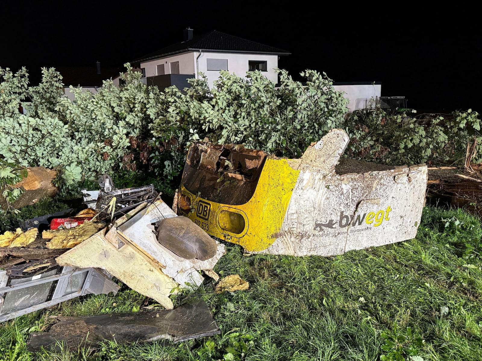 A front section of the derailed regional passenger train lies in a wooded section of track near Riedlingen, Germany, Sunday, July 27, 2025. (Nico Pointner/dpa via AP)