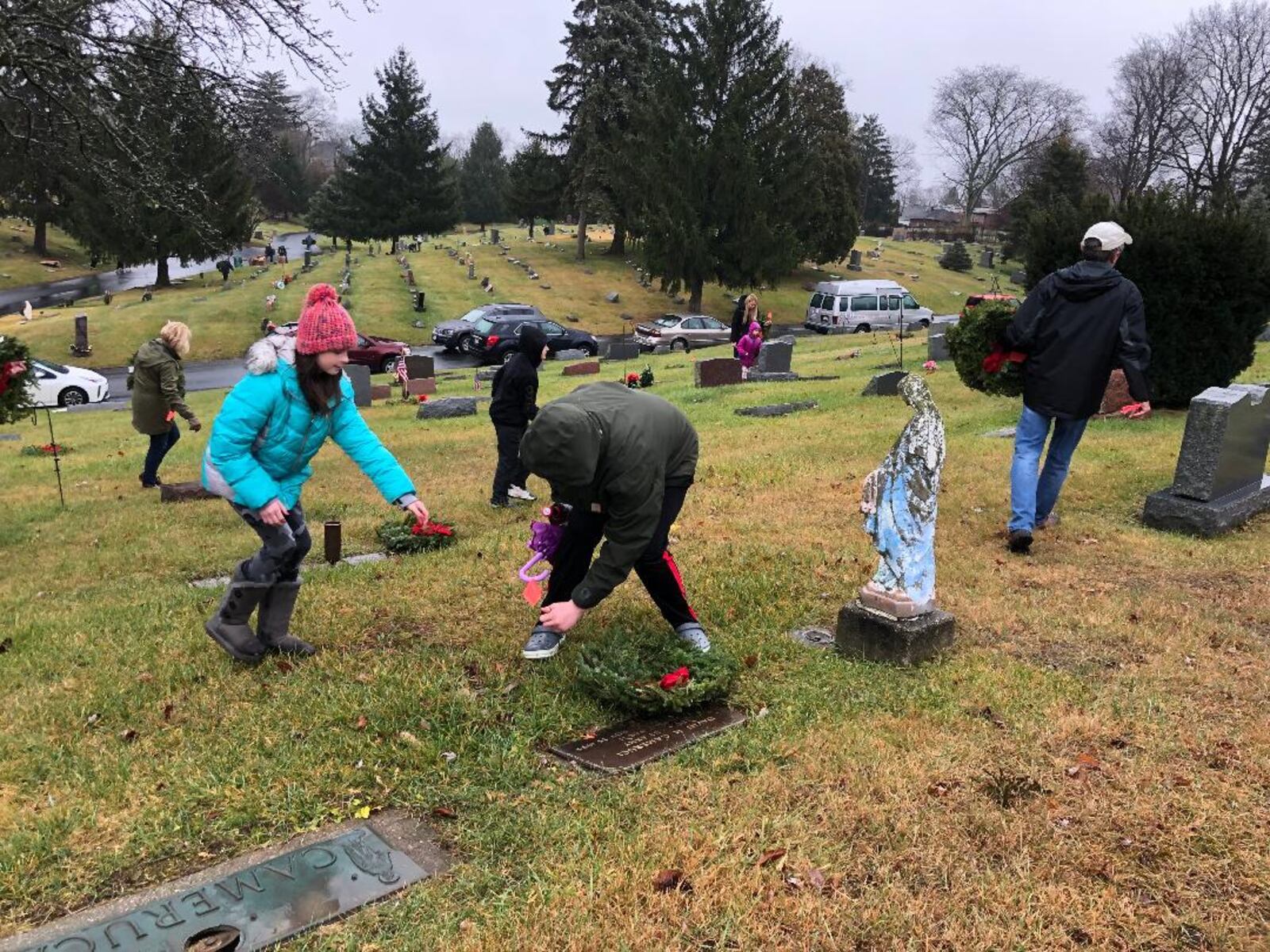 More than 100 people gathered at St. Bernard Cemetery to support the first event there for National Wreaths Across America Day. Another event was held across town at Springfield Burying Grounds. Photo by Brett Turner
