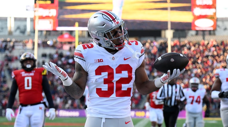 Ohio State running back TreVeyon Henderson celebrates his touchdown during the first half of an NCAA college football game against Maryland, Saturday, Nov. 19, 2022, in College Park, Md. (AP Photo/Nick Wass)