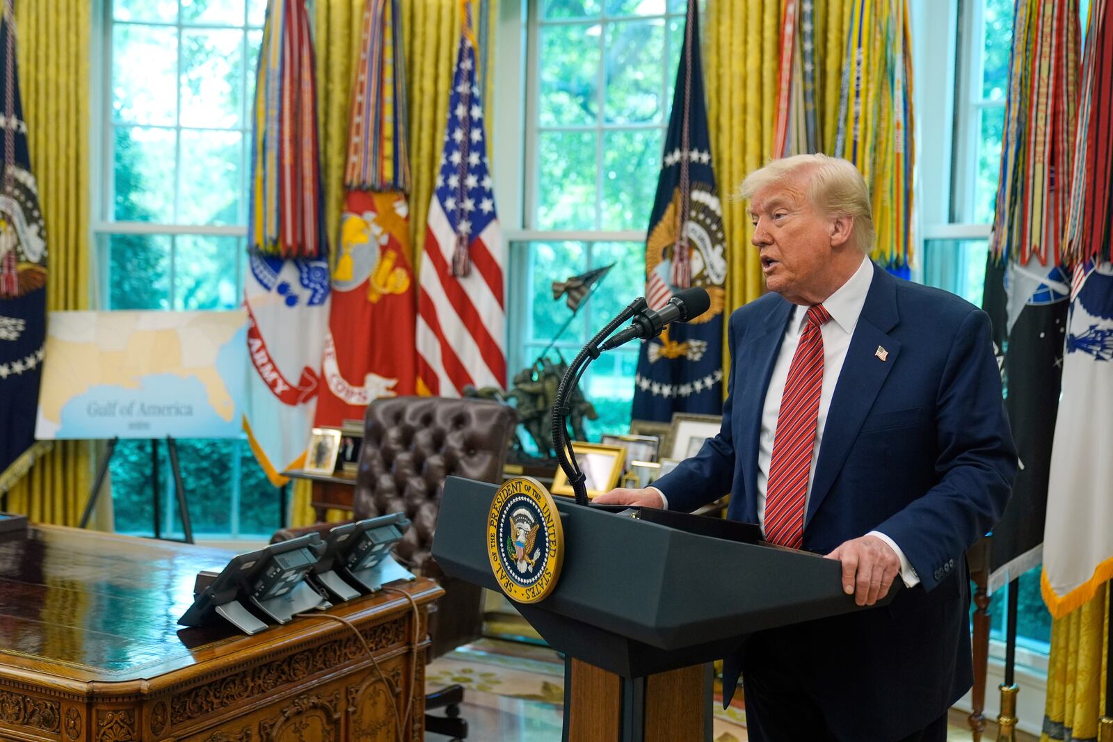 President Donald Trump speaks to reporters after David Perdue was sworn in as U.S. Ambassador to China during a ceremony in the Oval Office of the White House, Wednesday, May 7, 2025, in Washington. (AP Photo/Mark Schiefelbein)