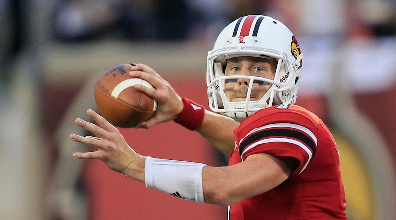 FILE - Louisville quarterback Will Stein readies a pass during the first half of their NCAA college football game against Florida International, Sept. 9, 2011, in Louisville, Ky. (AP Photo/Ed Reinke, File)