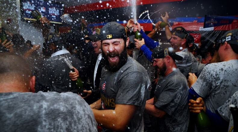 Chicago Cubs starting pitcher Jake Arrieta celebrates in the clubhouse after defeating the Cleveland Indians in game seven of the 2016 World Series at Progressive Field.