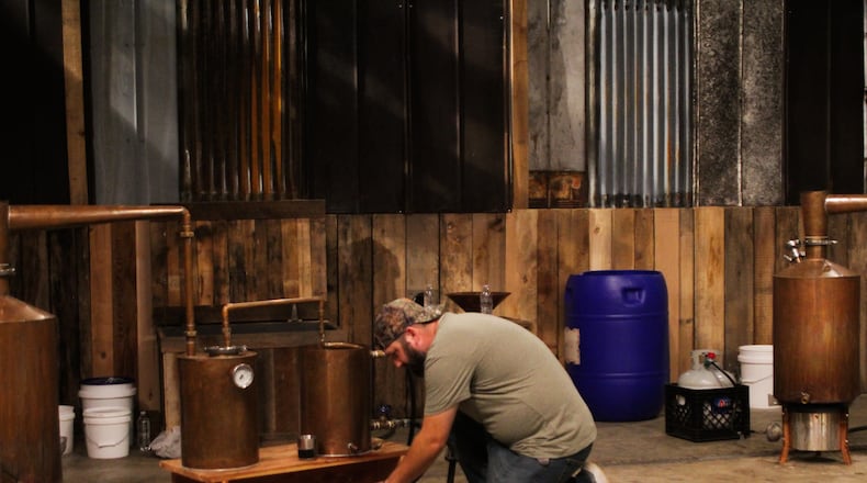 Springfield resident Shawn Rigsby getting vodka from his still on Discovery Channel's Master Distiller. CONTRIBUTED