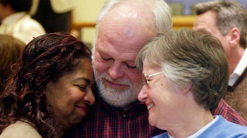 Former Springfield school superintendent Jean Harper, former Mayor Warren Copeland and his wife Clara Copeland embrace after finding out Springfield City School district passed a levy in this 2006 photo.
News-Sun Photo by Teesha McClam