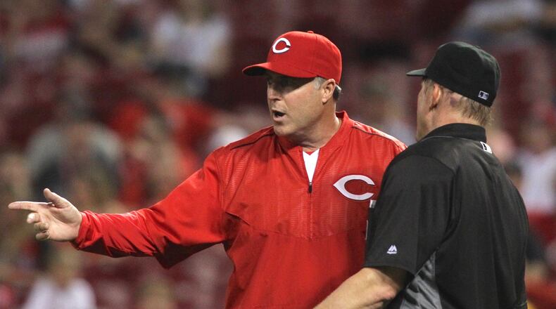 Reds manager Bryan Price argues with an umpire following the ejection of reliever Ross Ohlendorf on May 11, 2016, at Great American Ball Park in Cincinnati. David Jablonski/Staff