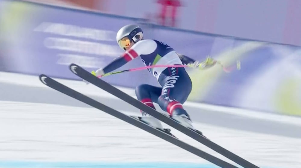 In this image taken from video provided by Olympic Broadcasting Services, OBS, United States' Lindsey Vonn crashes during an alpine ski women's downhill race, at the 2026 Winter Olympics, in Cortina d'Ampezzo, Italy, Sunday, Feb. 8, 2026. (Olympic Broadcasting Services via AP)